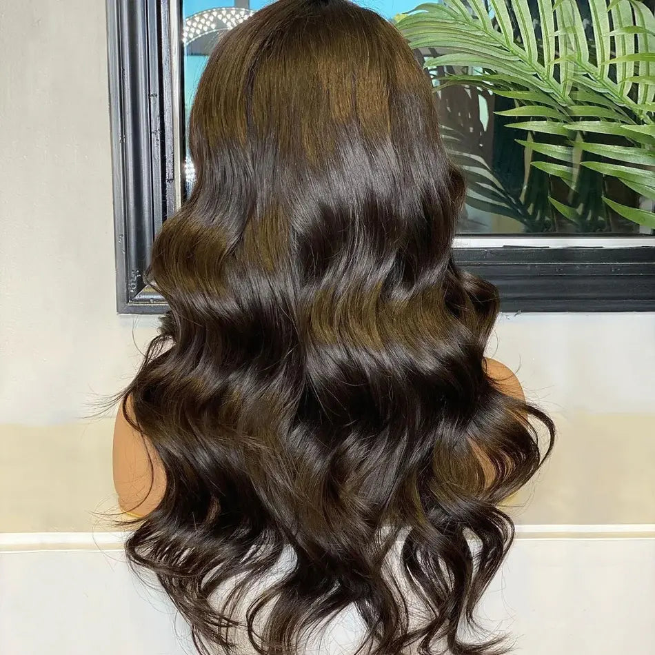 Back view of Body Wave Transparent Pre-Bleached Lace Frontal Wig showcasing natural black color, soft waves, and full 180% density.