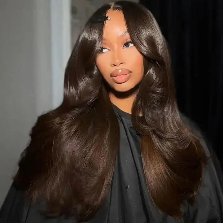 #2 Dark Brown body wave glueless wig with curtain bangs, styled in voluminous waves for a natural and elegant look.