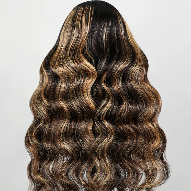 Wavy hair extension with brown and black color gradient on a light gray background