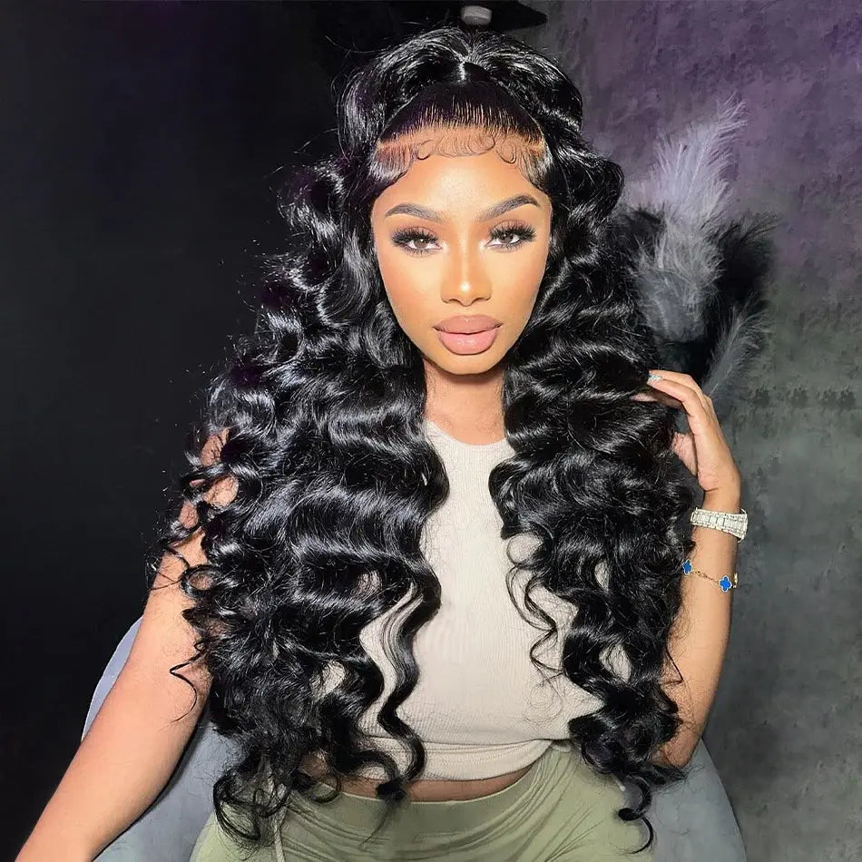 Transform your look with our Loose Deep Wave Pre-Plucked 13x6 HD Full Frontal Lace Wig, made from 100% human hair. Featuring soft, defined waves and a pre-plucked hairline, this wig offers a seamless HD lace front for a natural look. With free parting and a comfortable fit, it's perfect for any style.