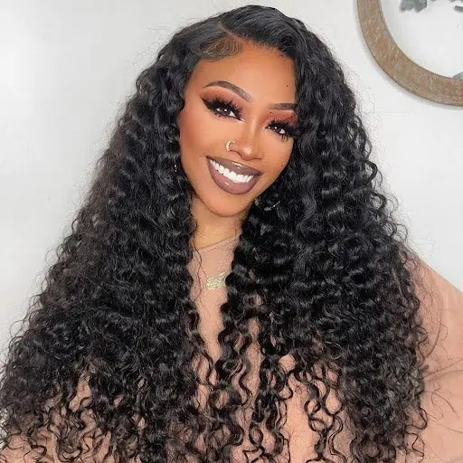 Smiling model wearing the Wear & Go 9*6 HD Lace Closure M-Cap Pre-Cut Wig, highlighting its pre-cut lace and natural deep wave curls.