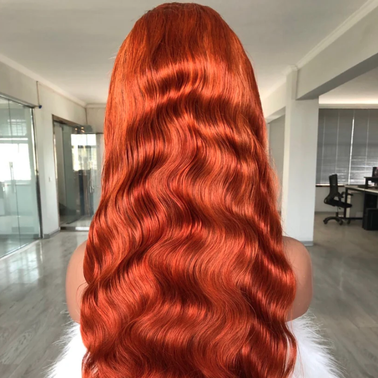 Person with long, wavy red hair in an indoor setting