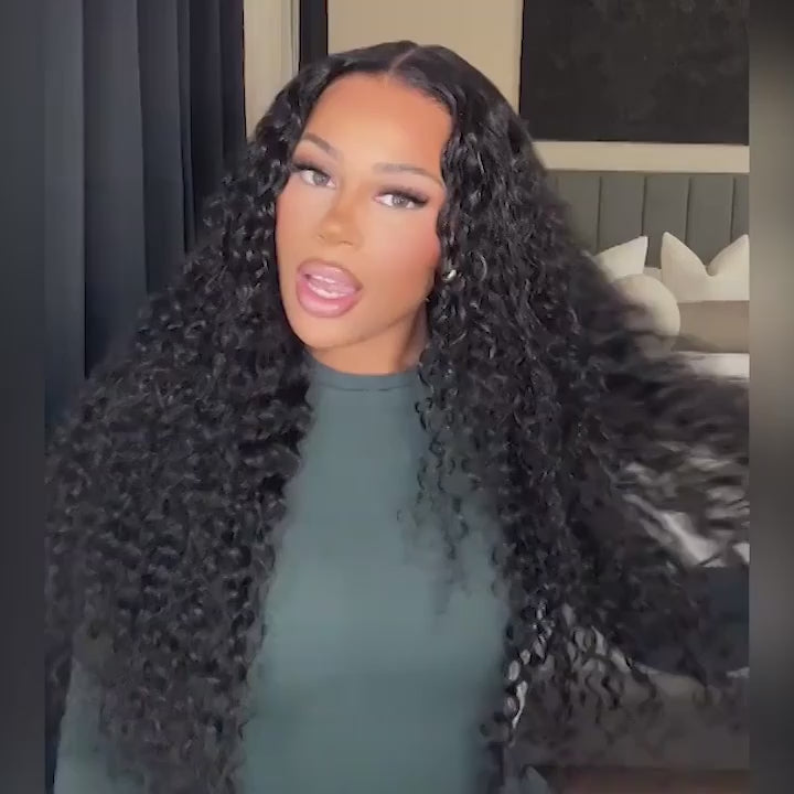 Model styling the Wear & Go 9*6 HD Lace Closure M-Cap Pre-Cut Wig, demonstrating its natural movement and voluminous deep wave curls.