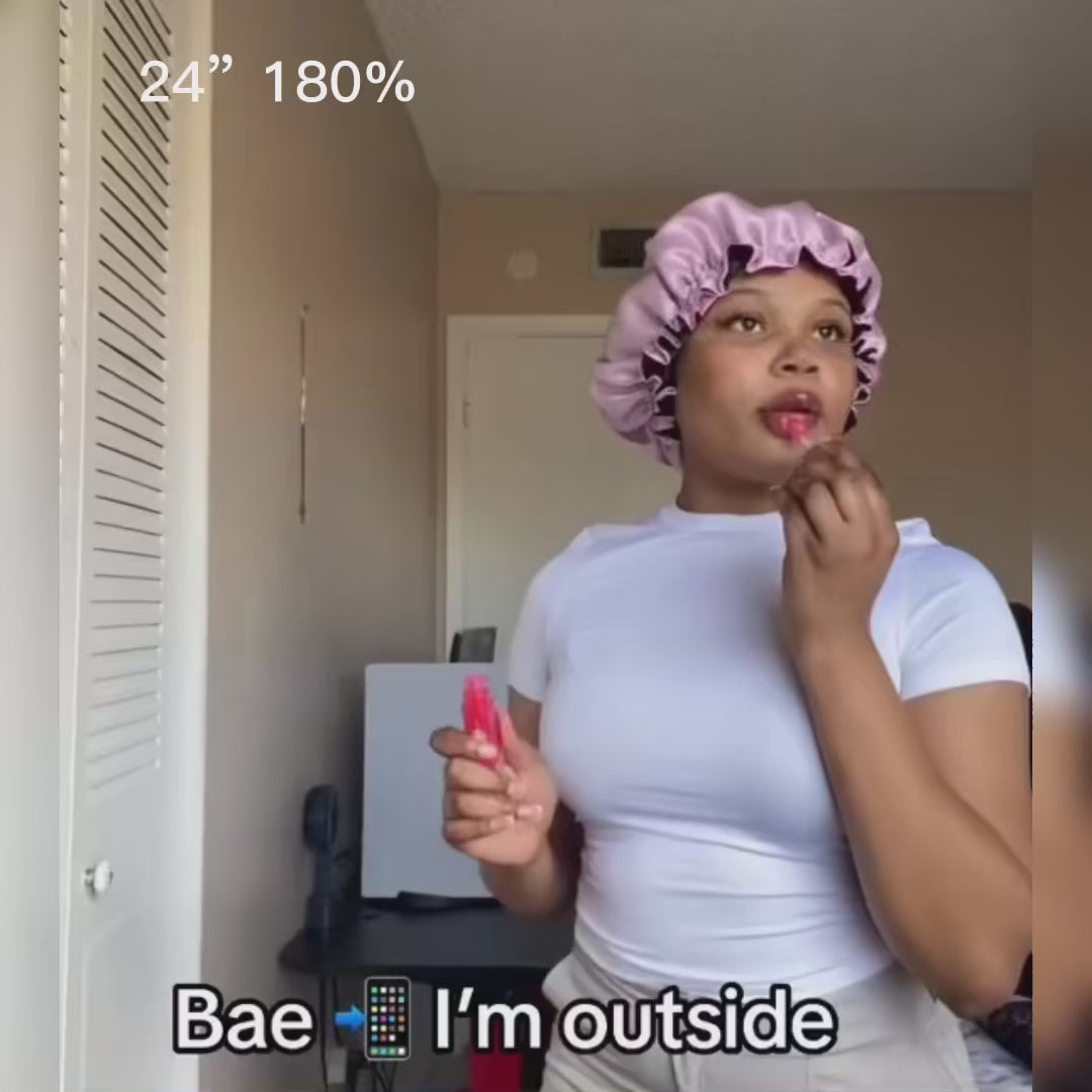 Model preparing to wear the 24-inch 180% density Water Wave Virgin HD Wig, demonstrating its voluminous and natural black wavy texture.