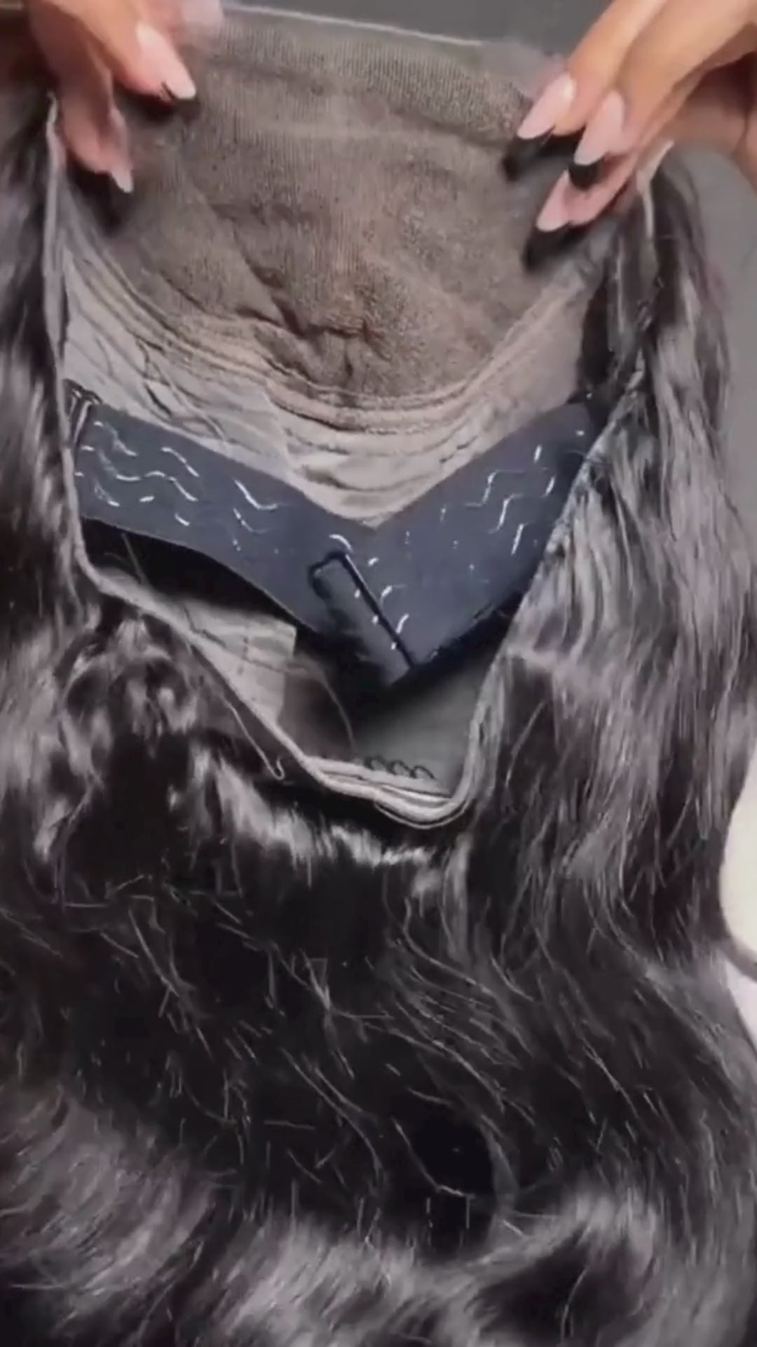 Inside view of Glueless Loose Deep Wave PRE-ALL HD 6*4.5 Wear & Go wig, showcasing adjustable straps and secure combs for a comfortable fit.