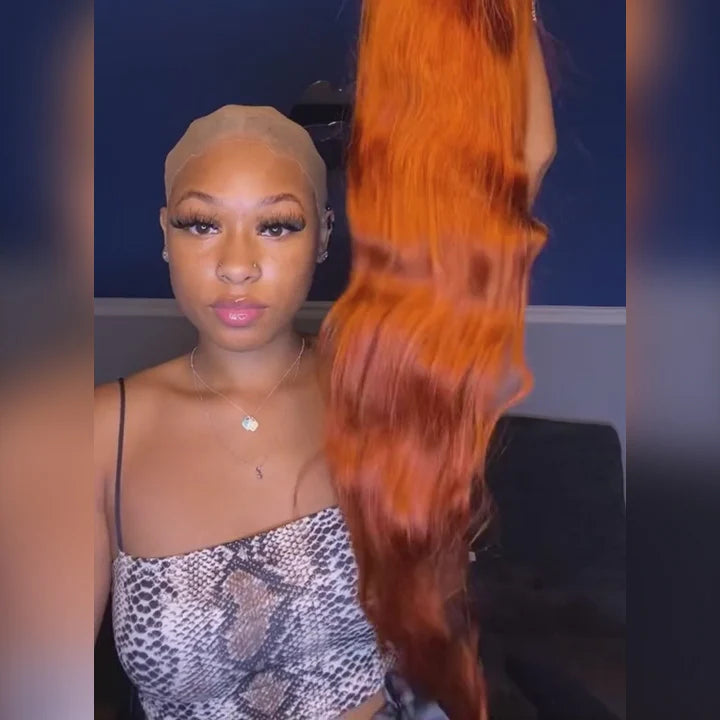 Model holding the Ginger #350 orange body wave wig before installation, highlighting its soft texture, 180% density, and glueless lace closure.