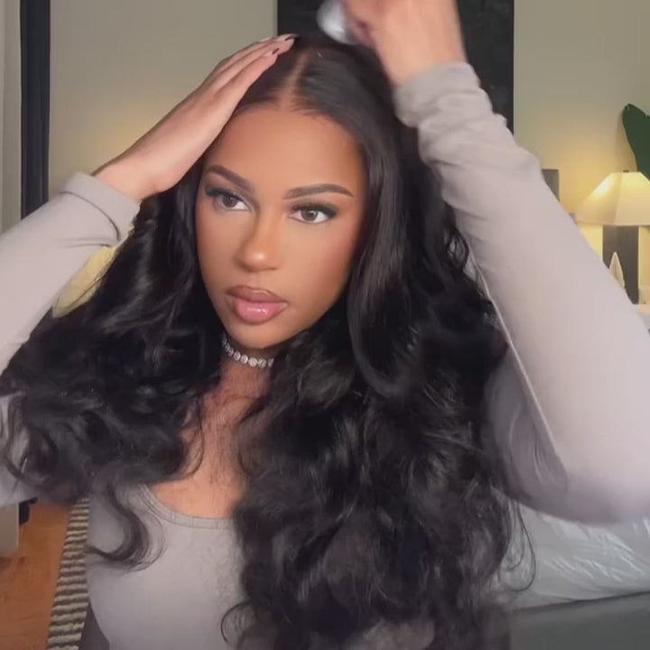 Woman styling the Glueless Pre-Bleached 7*5 HD Lace Closure Body Wave wig, demonstrating its beginner-friendly and natural-looking design.