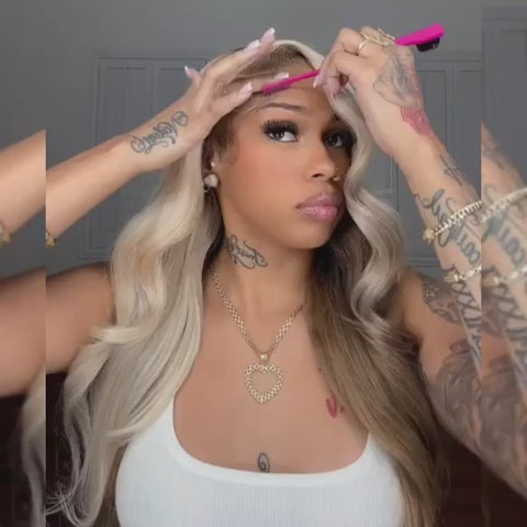 Model styling a champagne brown ombre body wave HD lace wig with baby hairs. Pre-plucked and pre-bleached for a realistic hairline.