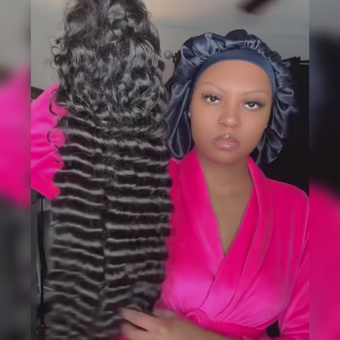 Loose Deep Wave Undetectable HD Lace Frontal Hair held by a model, showcasing its soft texture, deep wave pattern, and natural black color for a luxurious look.