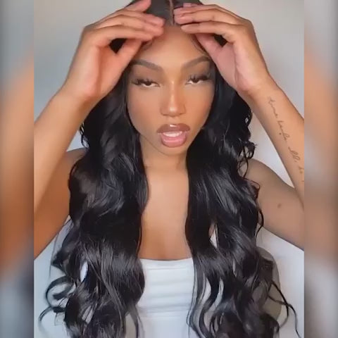 Model wearing Body Wave Transparent Pre-Bleached Lace Frontal Wig, adjusting the lace front for a seamless natural hairline look.